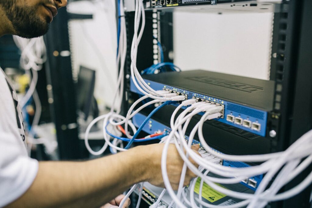 Photo by Field Engineer: https://www.pexels.com/photo/electronics-engineer-fixing-cables-on-server-442150/